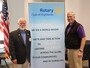 President O'Harra and ADG Bill Swift show the newest Rotary logo.